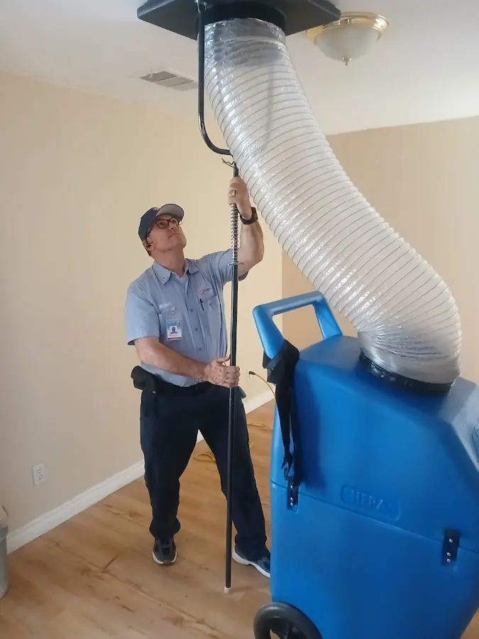 Furnace Tune-Up technician using HEPA equipment in Tarboro
